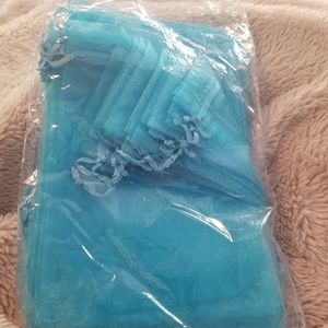 Bundle of blue organza drawstring jewelry bags